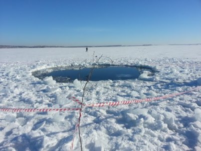 Chelyabinsk crater in frozen lake